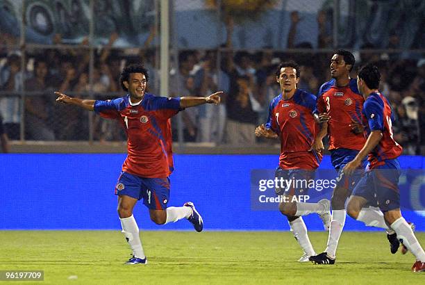 Costa Rica's midfielder Michael Barrantes celebrates with his teammates after scoring his goal against Argentina during their friendly football match...