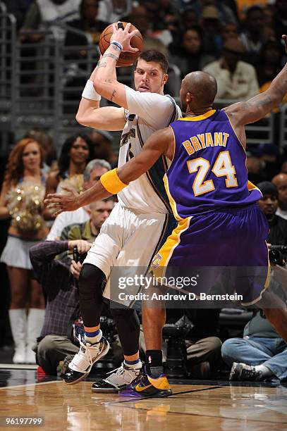 Mike Miller of the Washington Wizards looks to pass against Kobe Bryant of the Los Angeles Lakers at the Verizon Center on January 26, 2010 in...