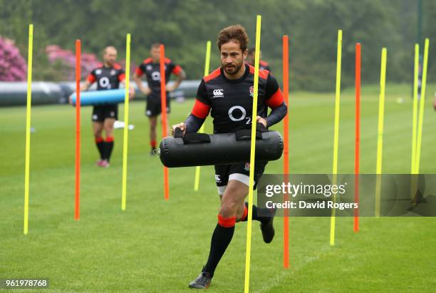 Danny Cipriani warms up carring a weight bag during the England training session held at Pennyhill Park on May 24, 2018 in Bagshot, England.