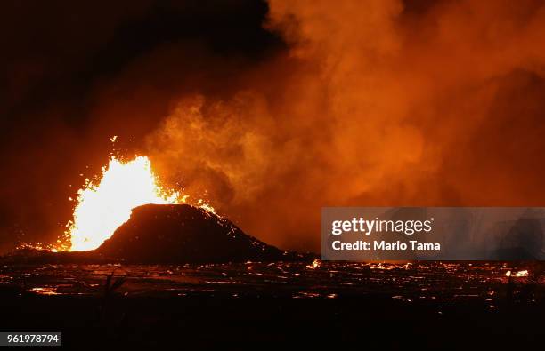 Lava erupts and flows from a Kilauea volcano fissure in Leilani Estates, on Hawaii's Big Island, on May 23, 2018 in Pahoa, Hawaii. Officials are...