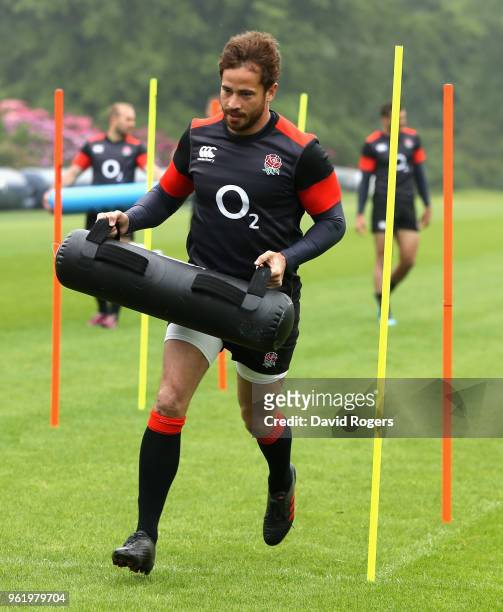 Danny Cipriani warms up carring a weight bag during the England training session held at Pennyhill Park on May 24, 2018 in Bagshot, England.