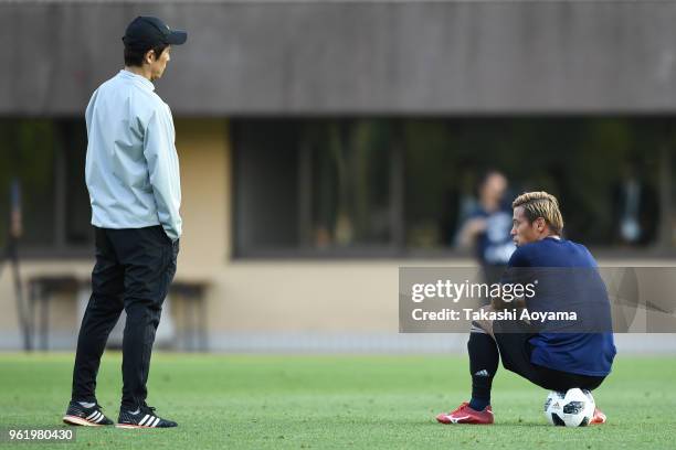 Head coach Akira Nishino speaks with Keisuke Honda during a Japan training session at Akitsu Football Field on May 24, 2018 in Narashino, Chiba,...