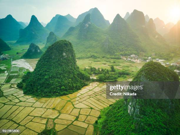 aerial view of karst mountains and rice fields near guilin, yangshuo - river li stock pictures, royalty-free photos & images