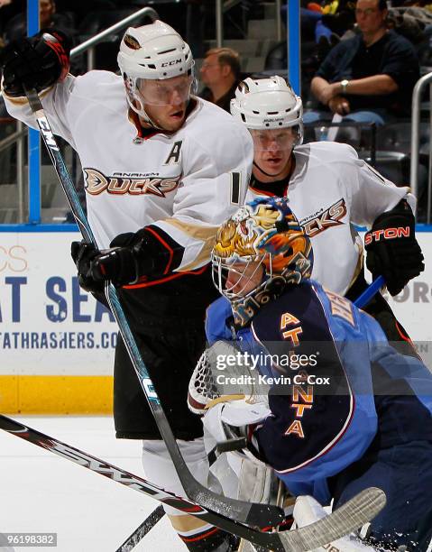 Goaltender Johan Hedberg of the Atlanta Thrashers saves a shot on goal in front of Saku Koivu of the Anaheim Ducks at Philips Arena on January 26,...