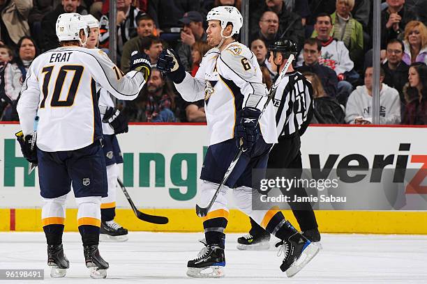 Shea Weber and Martin Erat congratulate each other after assisting on the goal by Patric Hornqvist, all of the Nashville Predators, during the third...