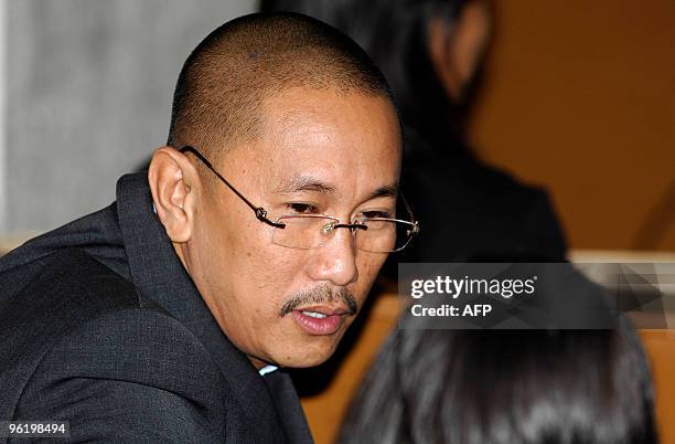 Vice Mayor Esmael Mangudadato talks to a lawyer in the courtroom prior to the start of the hearing of his rival, Andal Ampatuan Jnr, the prime...