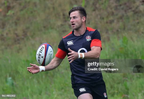 Henry Trinder passes the ball during the England training session held at Pennyhill Park on May 24, 2018 in Bagshot, England.