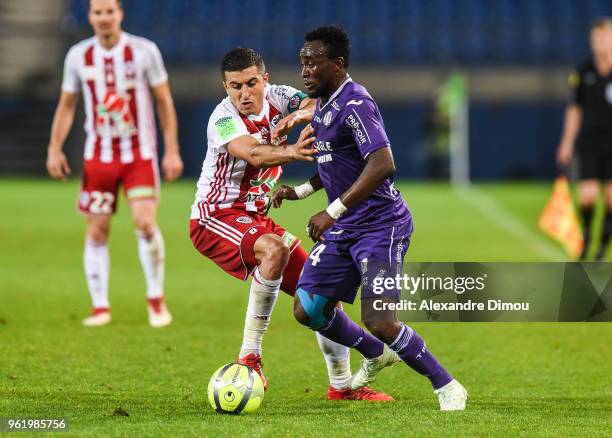 Riad Nouri of Ajaccio and Firmin Mubele of Toulouse during the Ligue 1 play-off match between AC Ajaccio and Toulouse at Stade de la Mosson on May...