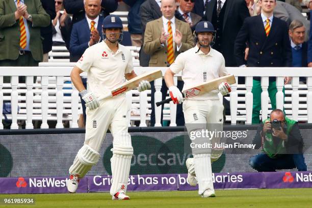 Alastair Cook and Mark Stoneman of England make their way onto the field during day one of the 1st Test match between England and Pakistan at Lord's...