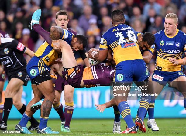 Corey Oates of the Broncos is picked up in the tackle during the round 12 NRL match between the Brisbane Broncos and the Parramatta Eels at Suncorp...