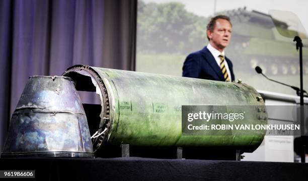 Head prosecutor Fred Westerbeke speaks next to a part of the BUK rocket that was fired on the Malaysia Airlines flight MH17 during the press...