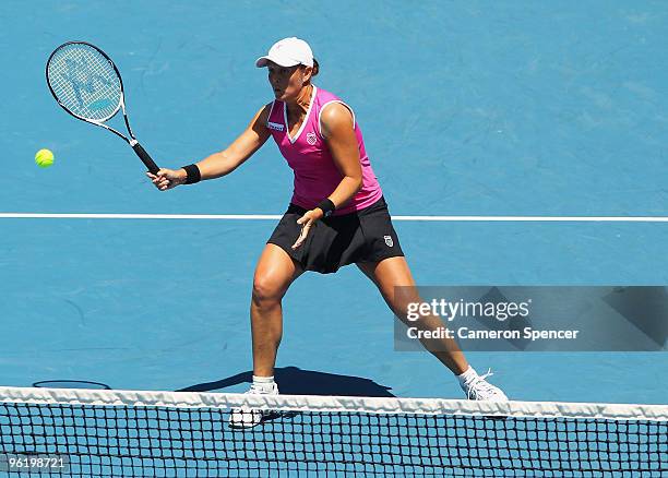 Liezel Huber of the USA plays a forehand in her fourth round doubles match with Cara Black of Zimbabwe against Alisa Kleybanova of Russia and...