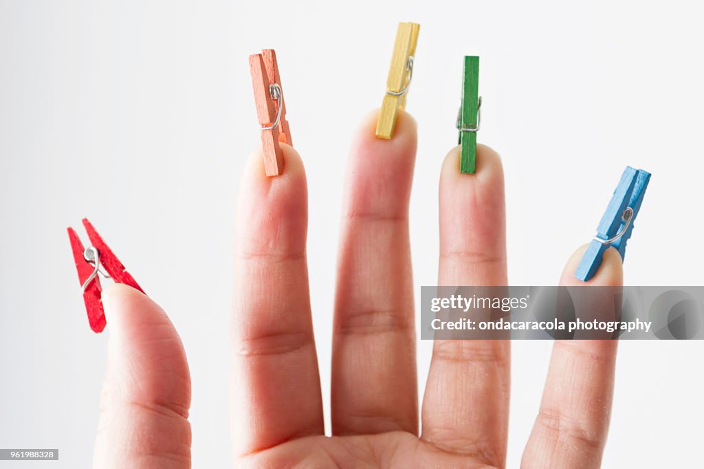 Mini pegs on fingers