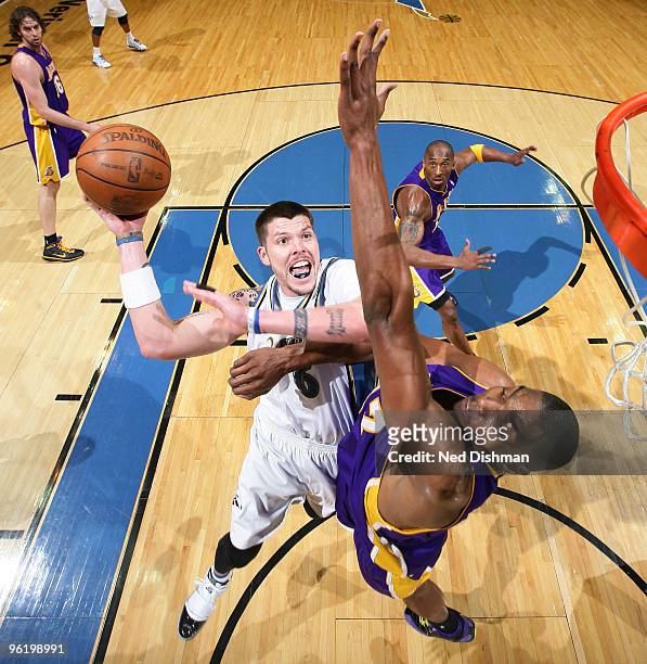 Mike Miller of the Washington Wizards shoots against Andrew Bynum of the Los Angeles Lakers at the Verizon Center on January 26, 2010 in Washington,...