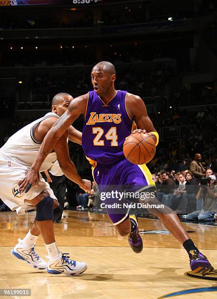 Kobe Bryant of the Los Angeles Lakers drives past Randy Foye of the Washington Wizards at the Verizon Center on January 26, 2010 in Washington, DC....