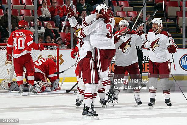 Keith Yandle of the Phoenix Coyotes, along with teammates Adrian Aucoin and Shane Doan, who had the assist on teammate Ed Jovanovski's game-tying...