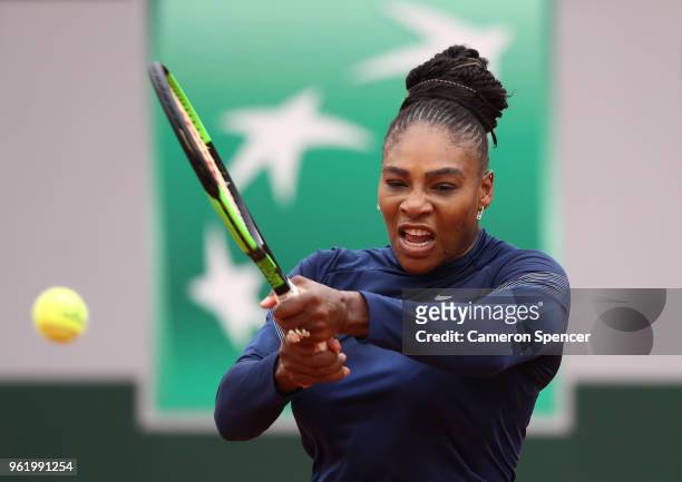 Serena Williams of the United States plays a backhand during a practice session ahead of the French Open at Roland Garros on May 24, 2018 in Paris,...