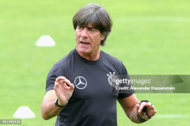 Joachim Loew, head coach of Germany gives intsructions to his players during a training session of the German national team at Sportanlage Rungg on...