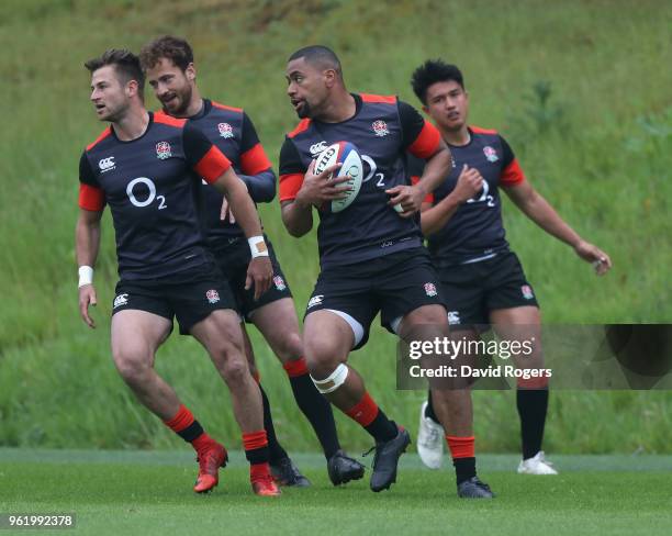 Henry Trinder, Danny Cipriani, Joe Cokanasiga and Marcus Smith warm up during the England training session held at Pennyhill Park on May 24, 2018 in...