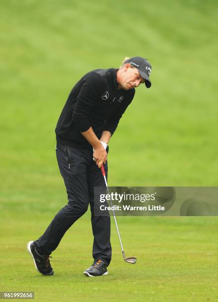 Marcel Siem of Germany reacts as he plays his second shot on the 4th hole during day one of the BMW PGA Championship at Wentworth on May 24, 2018 in...