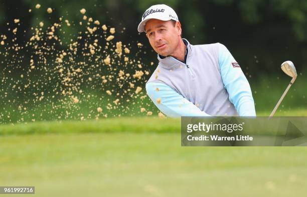 Brett Rumford of Australia plays from a bunker on the 4th hole during day one of the BMW PGA Championship at Wentworth on May 24, 2018 in Virginia...