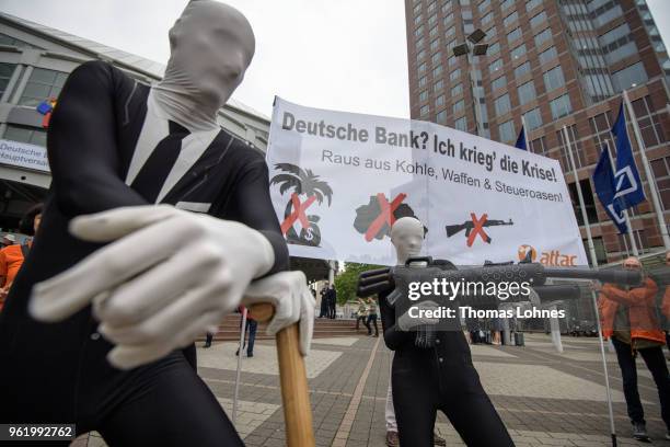 Activists of the Association for the Taxation of financial Transactions and Citizen's Action demonstrate against the Deutsche Bank before the...
