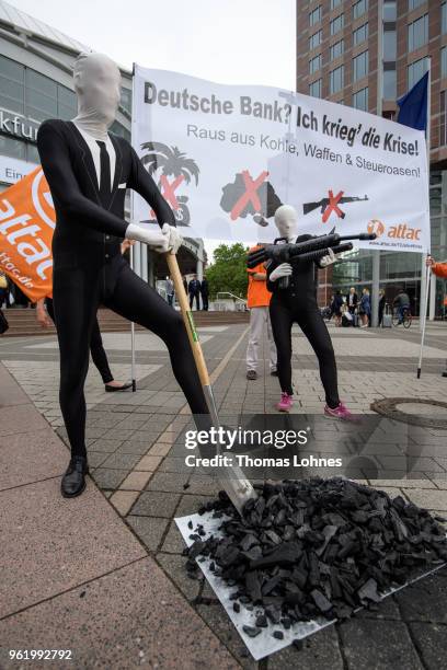 Activists of the Association for the Taxation of financial Transactions and Citizen's Action demonstrate against the Deutsche Bank before the...