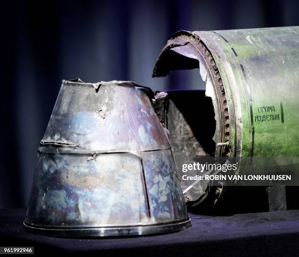 Part of the BUK-TELAR rocket that was fired on the MH17 flight is displayed on a table during the persconference of the Joint Investigation Team , in...