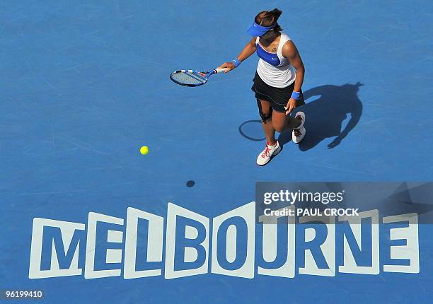 Li Na of China prepares to serve against Venus Williams of the US in their women's singles quarter-final match on day 10 of the Australian Open...