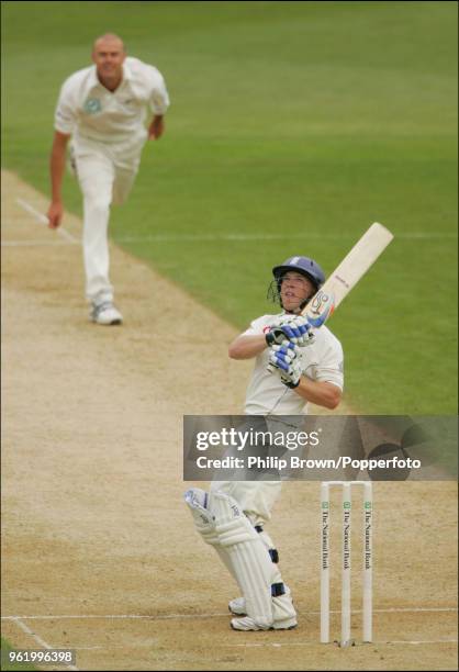 Tim Ambrose of England hits a delivery from Chris Martin of New Zealand for 6 runs during his innings of 102 runs in the 2nd Test match between New...