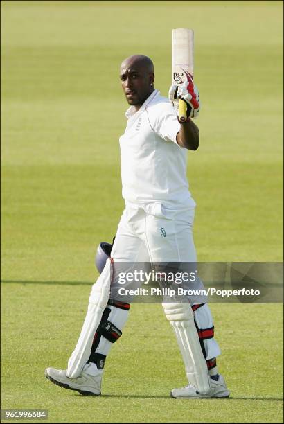 Michael Carberry of England Lions celebrates reaching his century during his innings of 108 runs in the tour match between England Lions and New...