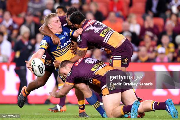 Daniel Alvaro of the Eels offloads during the round 12 NRL match between the Brisbane Broncos and the Parramatta Eels at Suncorp Stadium on May 24,...