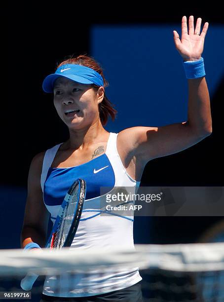 Li Na of China waves during her victory over Venus Williams of the US in their women's singles quarter-final match on day 10 of the Australian Open...