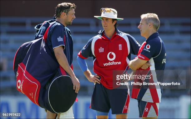 Steve Harmison of England talks with team captain Michael Vaughan and coach Peter Moores after a training session before the 2nd Test match against...