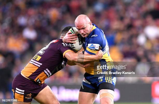 David Gower of the Eels takes on the defence during the round 12 NRL match between the Brisbane Broncos and the Parramatta Eels at Suncorp Stadium on...