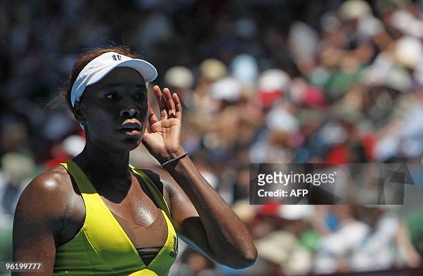 Venus Williams of the US gestures during her loss to Li Na of China in their women's singles quarter-final match on day 10 of the Australian Open...