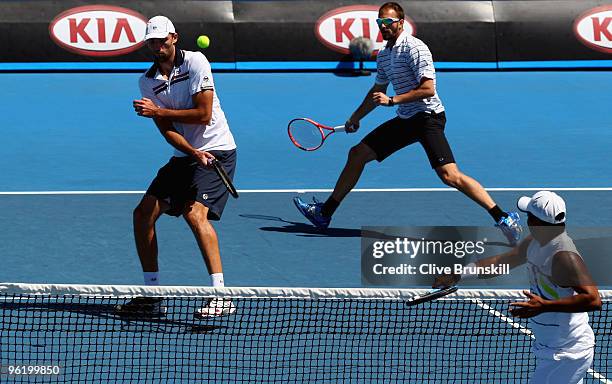 Dusan Vemic of Serbia and Ivo Karlovic of Croatia in their fourth round doubles match against Lukas Dlouhy of the Czech Republic and Leander Paes of...