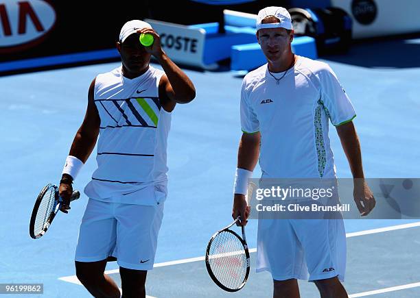 Lukas Dlouhy of the Czech Republic and Leander Paes of India talk tactics in their fourth round doubles match against Dusan Vemic of Serbia and Ivo...