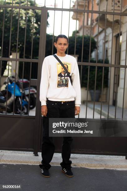 Model Binx Walton wears a white Martin Luther King Jr Black Heritage USA stamp sweatshirt, black pants, black Adidas sneakers during Milan Fashion...