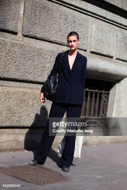 Model Sarah Boursin wears a long dark blue single button blazer and pants during Milan Fashion Week Spring/Summer 2018 on September 23, 2017 in...