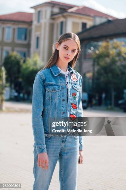 Model Maria Zaragoza wears a Route 66 patch denim jacket and jeans during Milan Fashion Week Spring/Summer 2018 on September 23, 2017 in Milan, Italy.