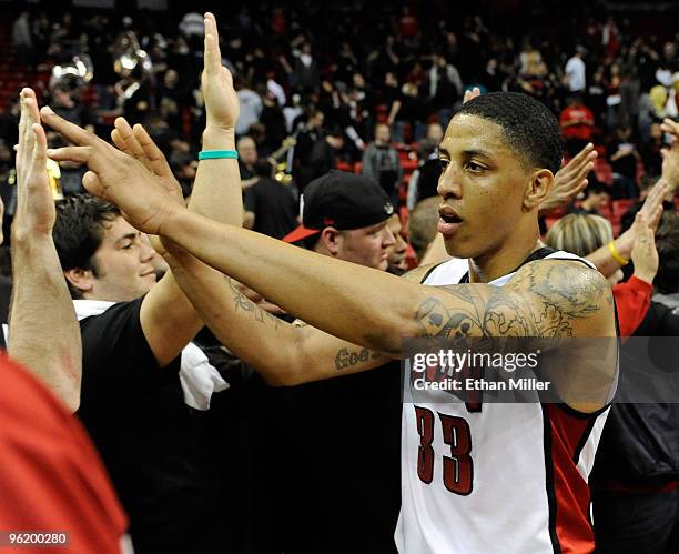 Tre'Von Willis of the UNLV Rebels celebrates the Rebels 60-50 victory over the Air Force Falcons with fans at the Thomas & Mack Center January 26,...