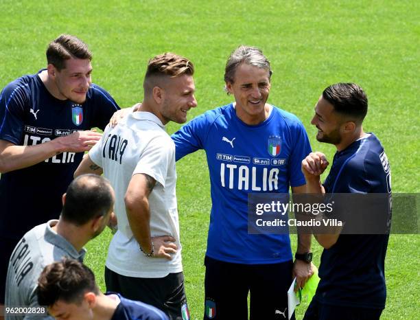 Ciro Immobile, head coach Italy Roberto Mancini and Danilo D'Ambrosio chat during a Italy training session at Centro Tecnico Federale di Coverciano...