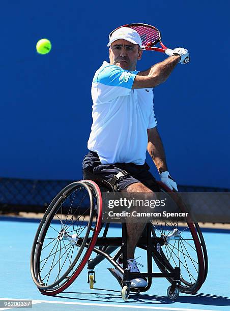 Stephane Houdet of France plays a backhand in his Wheelchair Singles quarterfinals match against Maikel Scheffers of the Netherlands during day ten...