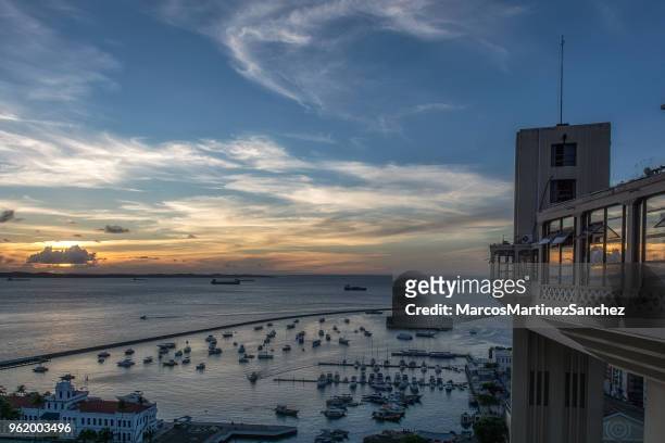 sunset at lacerda elevator, historical center of salvador, bahia, brazil - lacerda elevator stock pictures, royalty-free photos & images