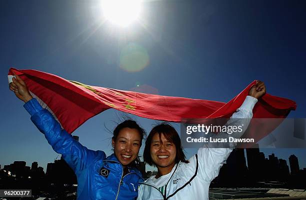 Jie Zheng and Na Li of China pose with the Chinese flag at Grand Slam Oval during day ten of the 2010 Australian Open at Melbourne Park on January...