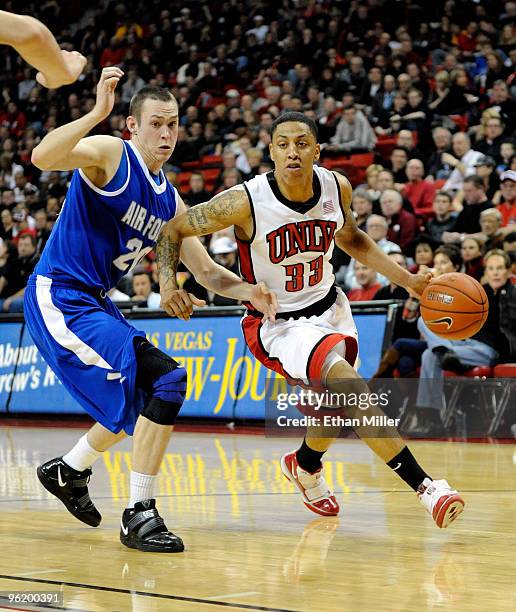 Tre'Von Willis of the UNLV Rebels drives past Tom Fow of the Air Force Falcons during their game at the Thomas & Mack Center January 26, 2010 in Las...