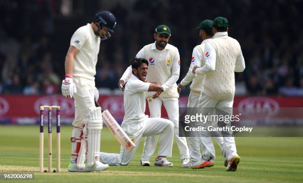 Hasan Ali of Pakistan celebrates dismissing England captain Joe Root during the NatWest 1st Test match between England and Pakistan at Lord's Cricket...