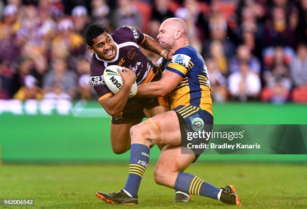 Anthony Milford of the Broncos attempts to break away from the defence during the round 12 NRL match between the Brisbane Broncos and the Parramatta...