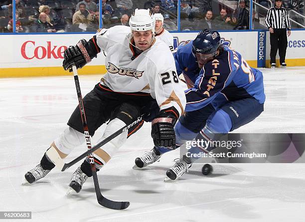 Kyle Chipchura of the Anaheim Ducks battles for the puck against Nik Antropov of the Atlanta Thrashers at Philips Arena on January 26, 2010 in...